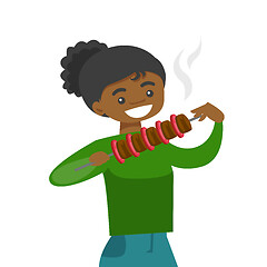 Image showing Young african-american woman eating shashlik.