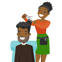 Image showing Hairdresser making a haircut to a young man.