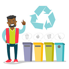 Image showing African man standing next to the garbage bins.