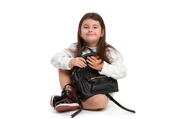 Image showing portrait of cute little kid in stylish jeans clothes looking at camera and smiling