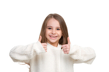 Image showing portrait of cute little kid in stylish knitted, sweater looking at camera and smiling