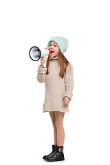 Image showing Little cute kid baby girl holding in hand and speaking in electronic gray megaphone