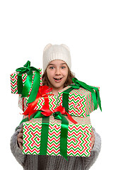 Image showing Full length portrait of cute little kid in stylish knitted sweater looking at camera and smiling