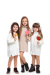 Image showing portrait of cute little kids in stylish clothes looking at camera and smiling