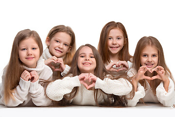 Image showing portrait of cute little kids in stylish clothes looking at camera and smiling