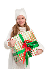 Image showing Full length portrait of cute little kid in stylish knitted sweater looking at camera and smiling