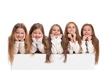 Image showing portrait of cute little kids in stylish clothes looking at camera and smiling