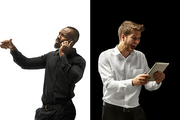 Image showing success happy afro and caucasian men. Mixed couple. Human facial emotions concept.