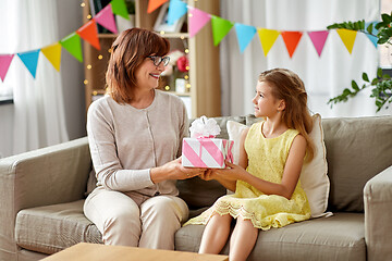 Image showing grandmother giving granddaughter birthday gift