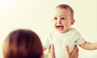 Image showing happy little baby with mother at home