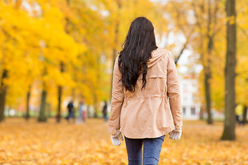 Image showing young woman walking in autumn park