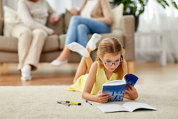 Image showing student girl with textbook learning at home