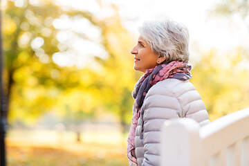 Image showing portrait of happy senior woman at autumn park