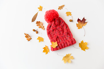 Image showing hat and fallen autumn leaves on white background