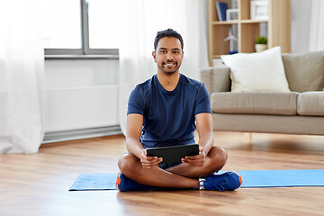 Image showing indian man with tablet pc and exercise mat at home