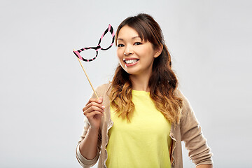 Image showing happy asian woman with big party glasses