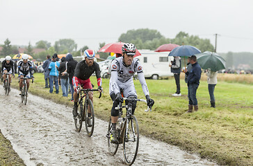 Image showing Group of Cyclists on a Cobblestone Road - Tour de France 2014