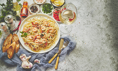 Image showing Seafood concept. Pasta with shrimps in a plate, close-up, copy space, top view, flat lay.