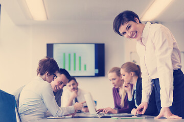 Image showing young  woman using  tablet on business meeting