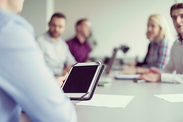 Image showing Businessman using tablet in modern office