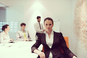 Image showing young business woman on meeting  using laptop computer