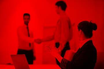 Image showing young business woman on meeting  using laptop computer