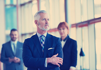 Image showing senior business man with his team at office