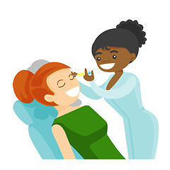 Image showing Woman receiving beauty facial injection in salon.