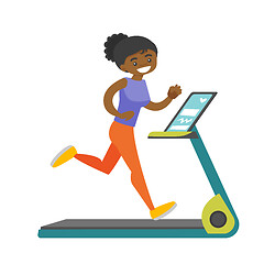 Image showing Young african-american woman running on treadmill.