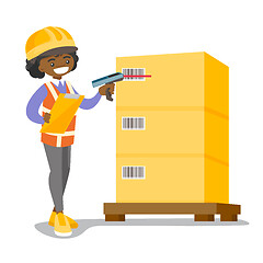 Image showing African warehouse worker scanning barcode on box.