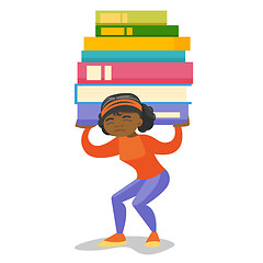 Image showing College student carrying a heavy pile of books.