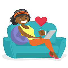 Image showing African-american woman dating online using laptop.