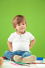 Image showing Portrait of happy little boy over green background