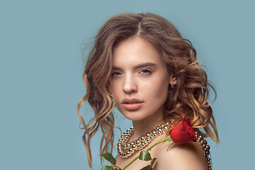 Image showing Beautiful young girl in studio with pearl jewelry - earrings, bracelet, necklace.