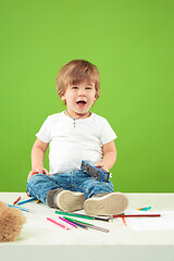 Image showing Portrait of happy little boy over green background