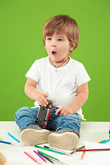 Image showing Portrait of happy little boy over green background