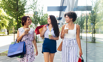 Image showing women with shopping bags and drinks in city