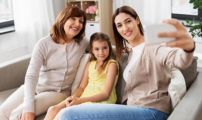 Image showing mother, daughter and grandmother taking selfie