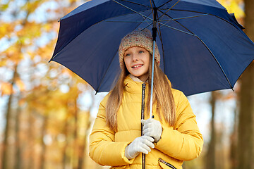 Image showing happy girl with umbrella at autumn park