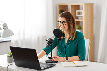 Image showing woman with microphone recording podcast at studio