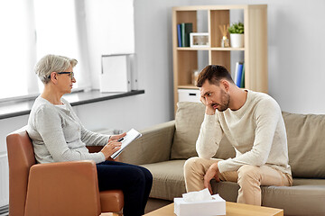 Image showing senior woman psychologist and sad man patient