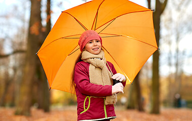 Image showing happy little girl with umbrella at autumn park