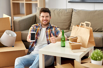 Image showing man with smartphone and takeaway food moving