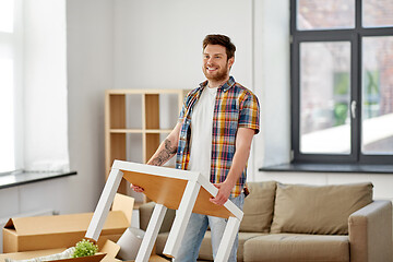 Image showing happy man with table moving to new home