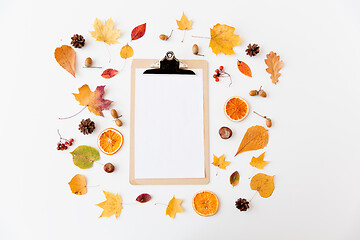 Image showing autumn fruits and clipboard with blank white paper