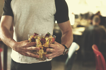 Image showing software developer eating a fruit salad