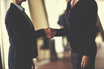 Image showing business womans make deal and handshake