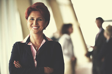 Image showing business people group, woman in front  as team leader