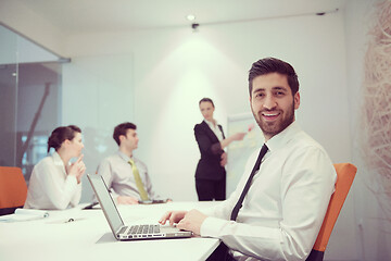 Image showing young business man at meeting