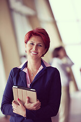 Image showing business woman  at office with tablet  in front  as team leader